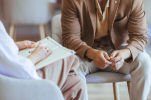 Psychiatrist Counseling Session with Male Client in a Bright Office.