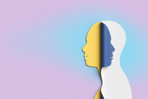 3D illustration of layered human profiles in contrasting colors symbolizing bipolar disorder.